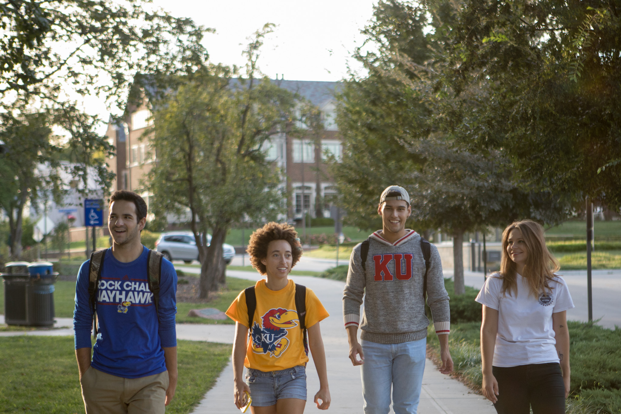 students walk down jayhawk boulevard